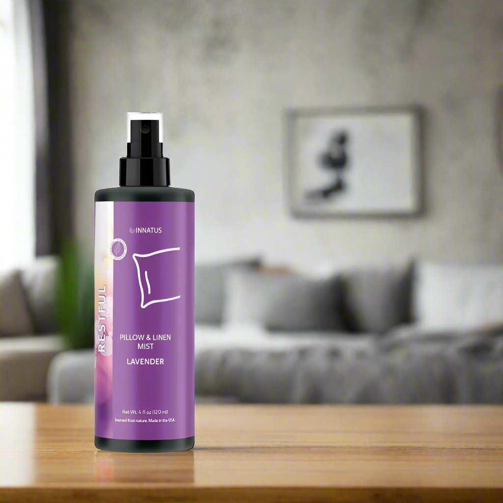Purple bottle with black spray nozzle on a white background