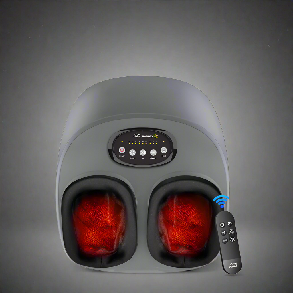 Gray foot massager with red interior lights and remote control on a white background
