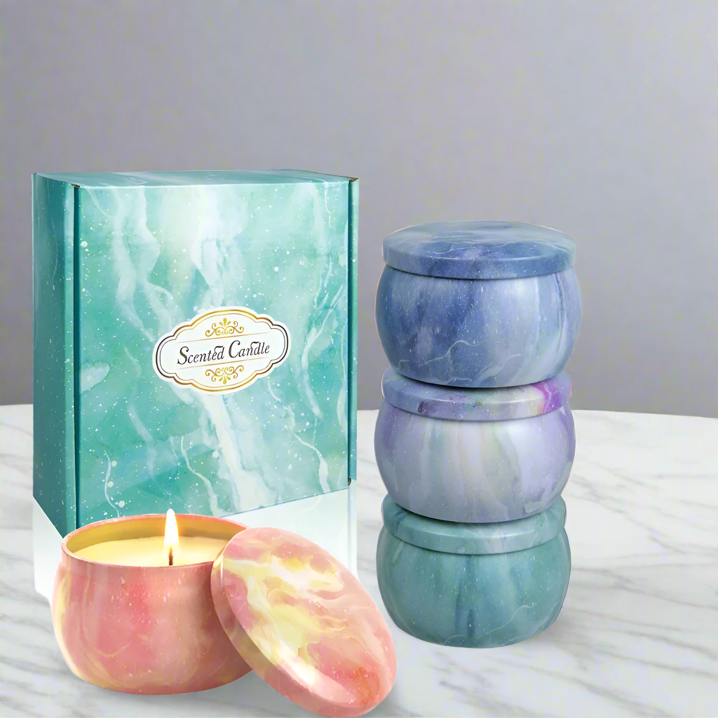 Marble-patterned candles with a decorative box on a white background
