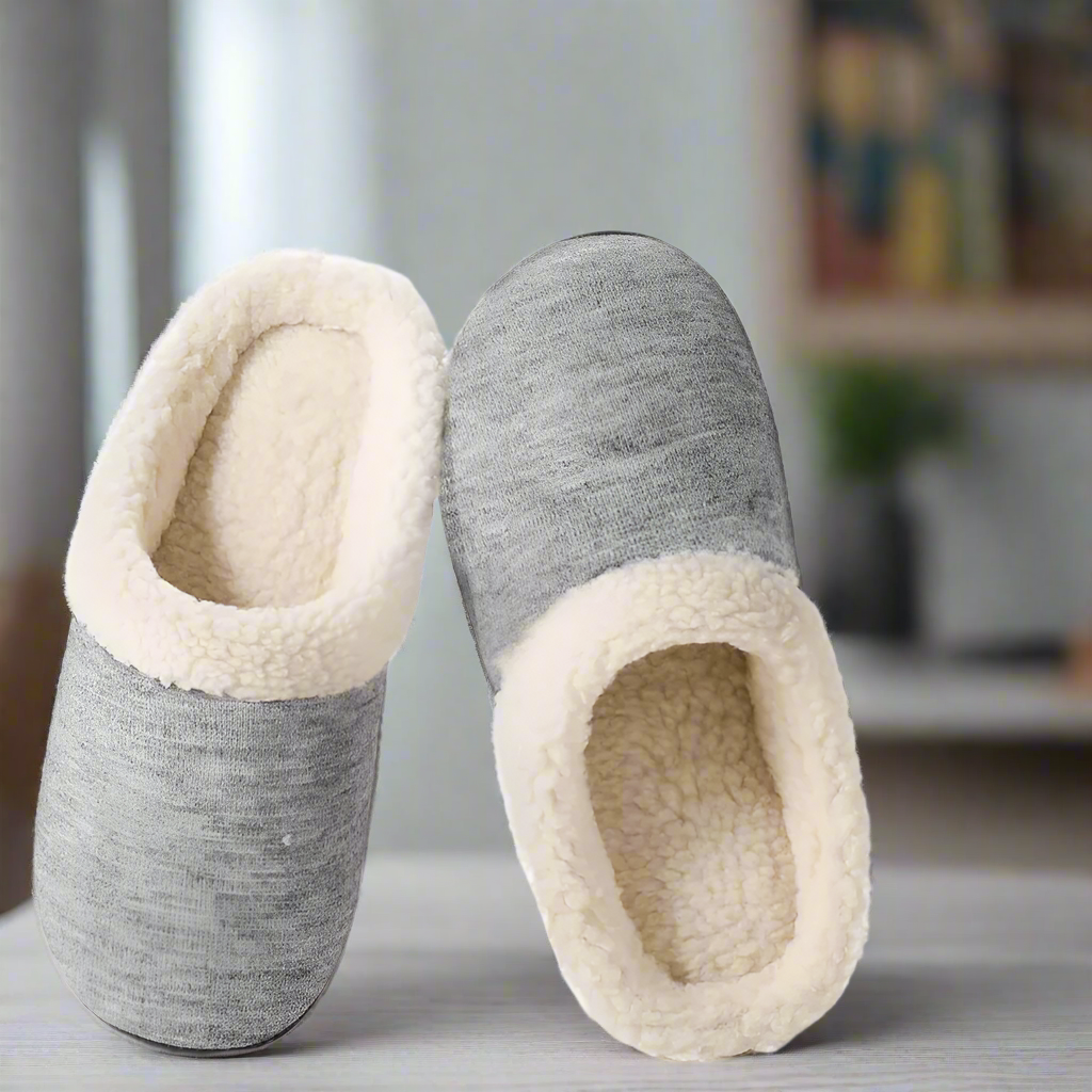 Pair of gray and beige slippers on a white background