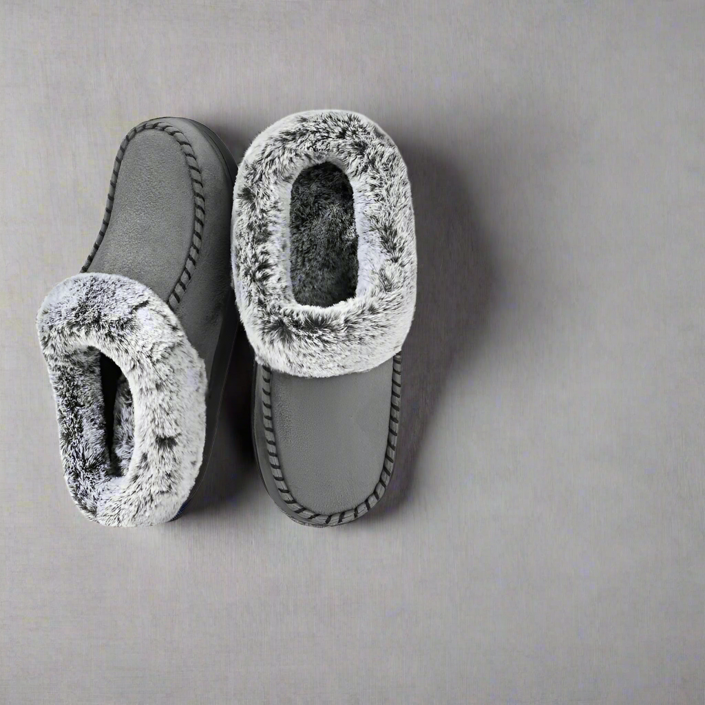Pair of gray slippers with fuzzy texture on a white background