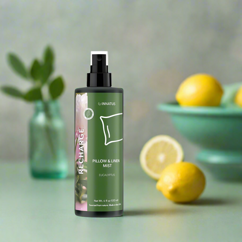Green bottle of Ginnatus Pillow & Linen Mist on a white background