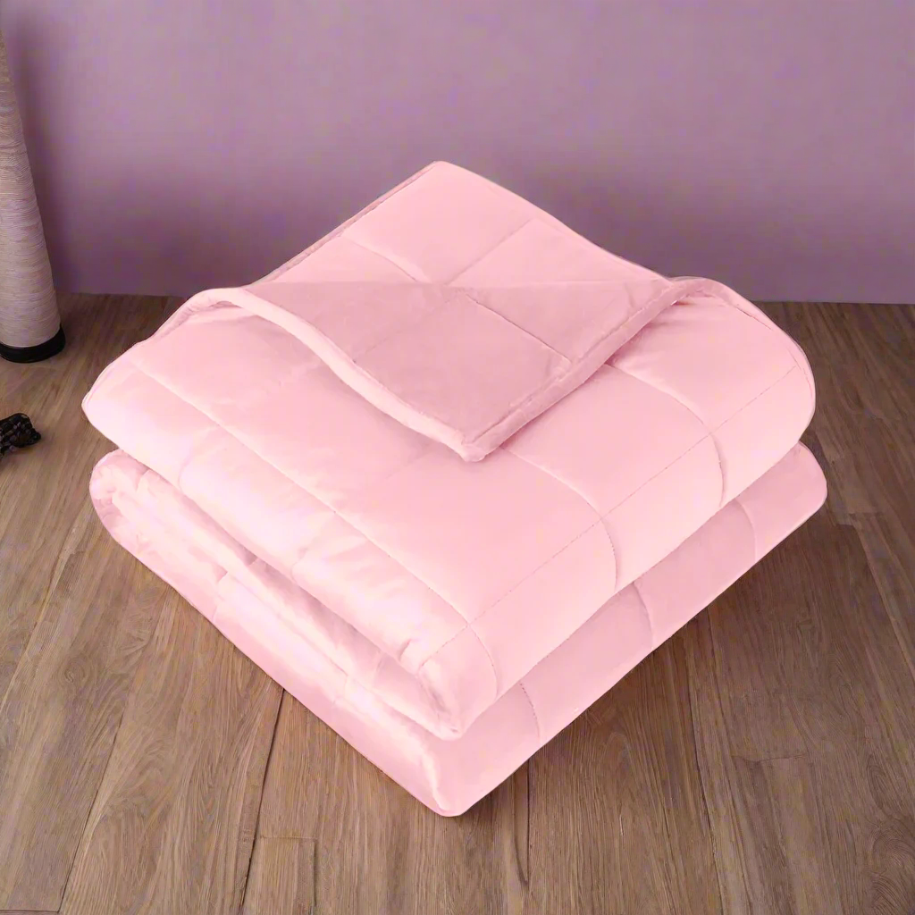 Pink comforter on a white background
